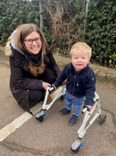 Steps student Alfie with his mum, Hollie, and the walker the Steps staff helped to get via the NHS